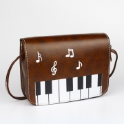 Dámská kabelka přes rameno s klaviaturou v hnědé barvě